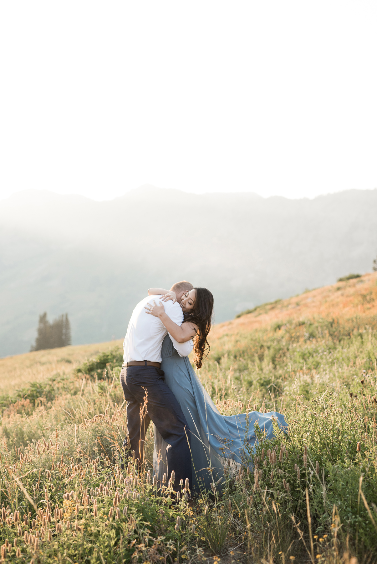 passionate embrace between bride and groom in albion basin