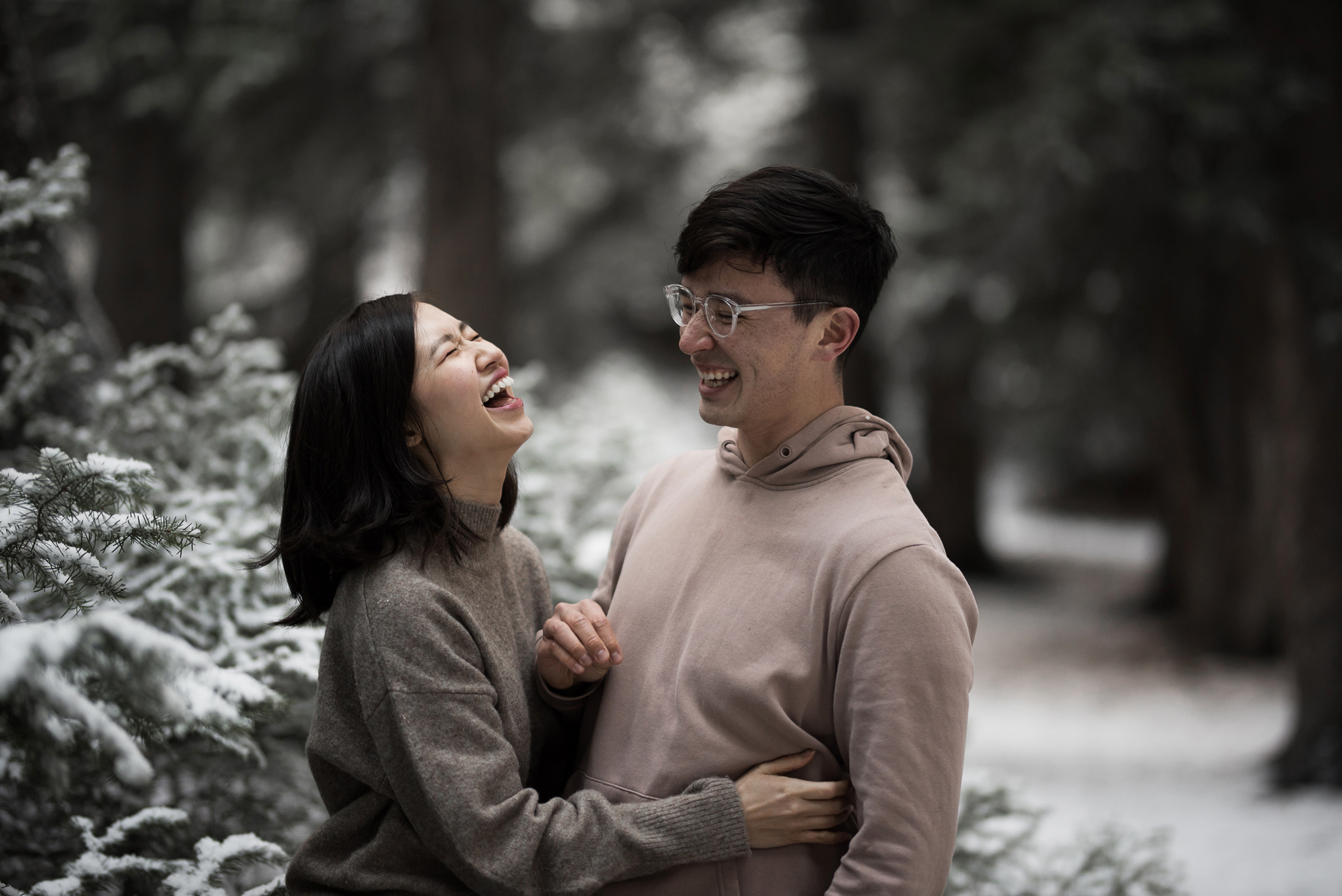 couple laughing together in the snow