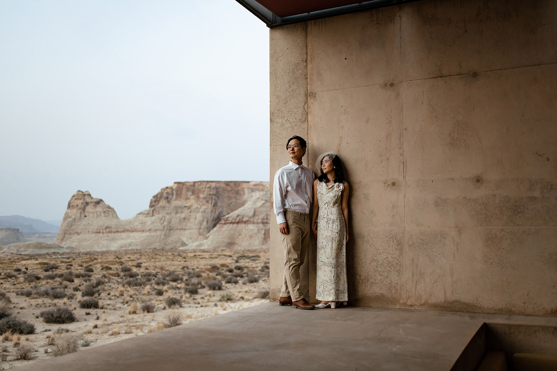 Couple standing together on an Amangiri deck.