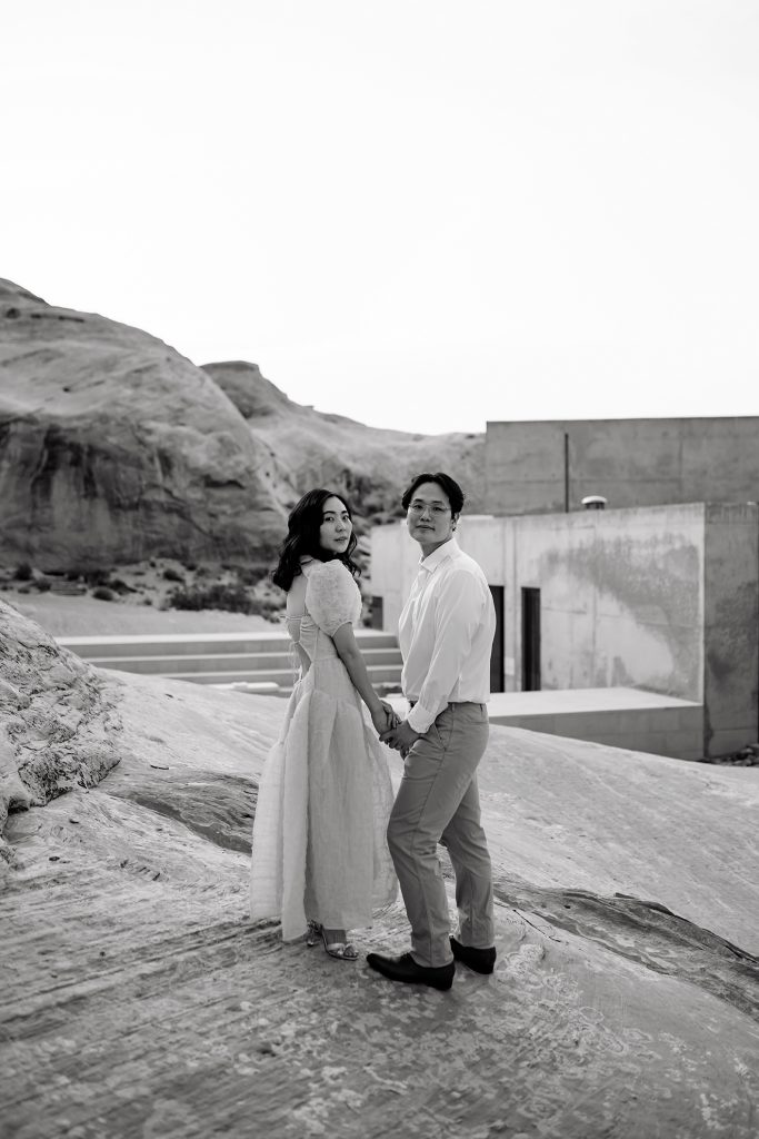 Black and white of the couple looking at the camera.