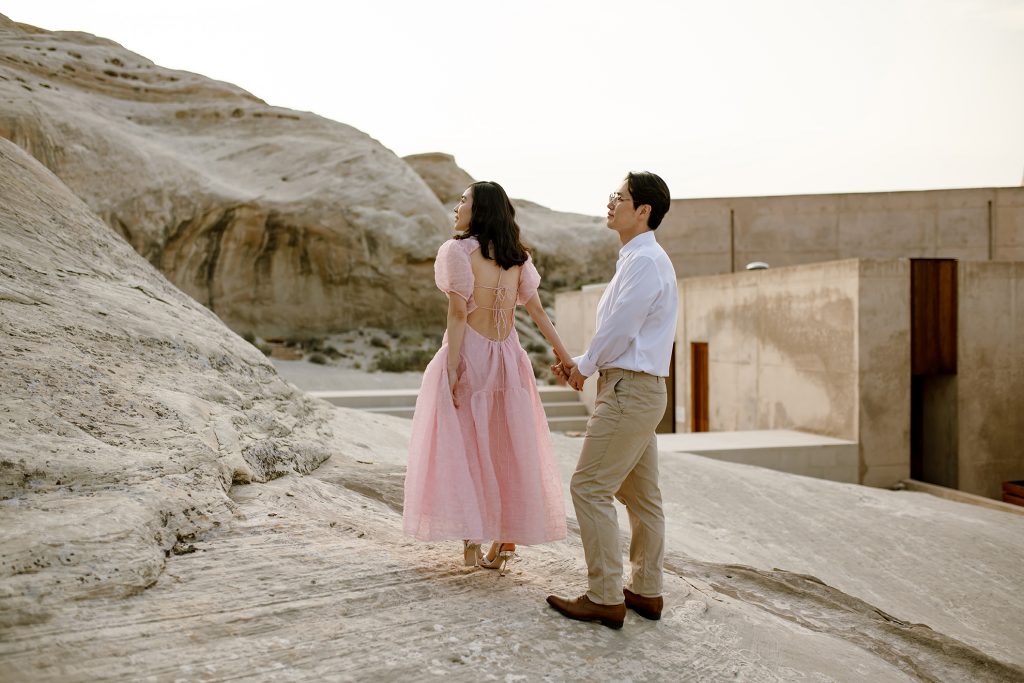 Instead they decide to turn around to look out at the desert once more.