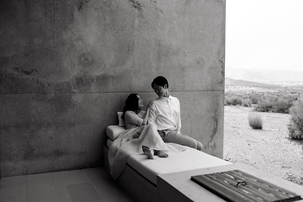 Husband and wife take a moment together on their patio at Amangiri.