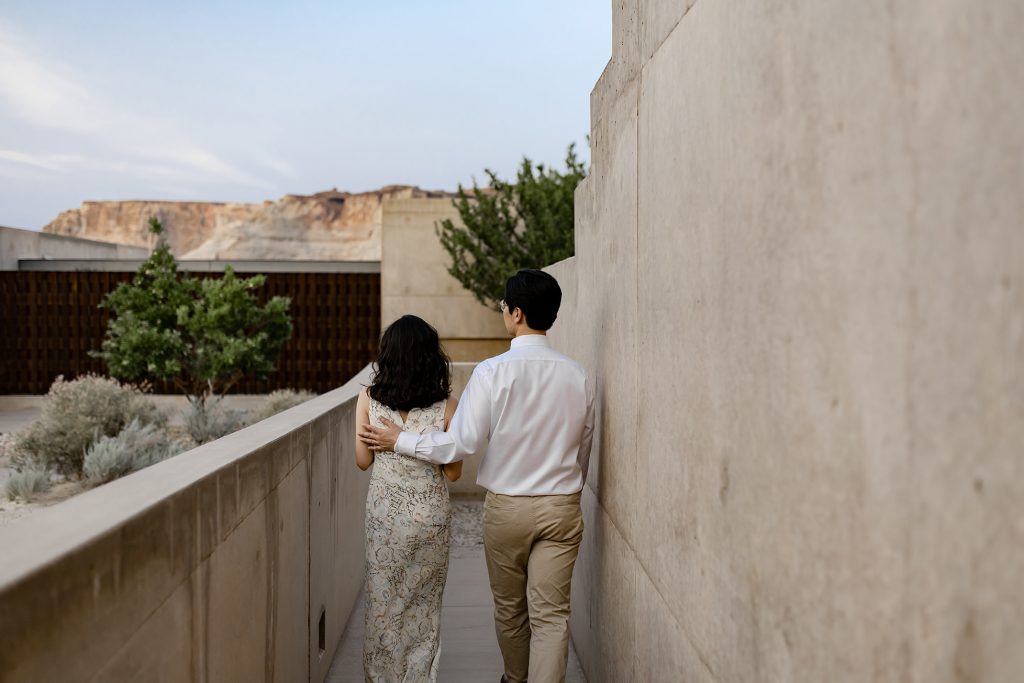 Groom leads his new wife down one of Amangiri's side walkway oasis.