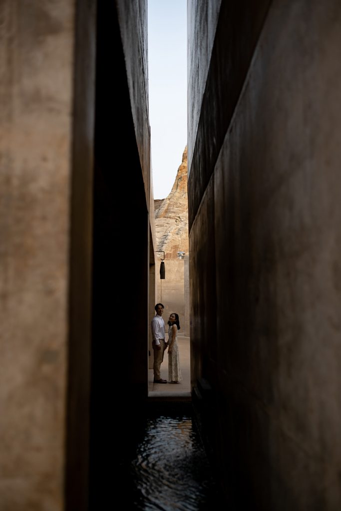 Bride and groom take a moment to themselves down an alley way.