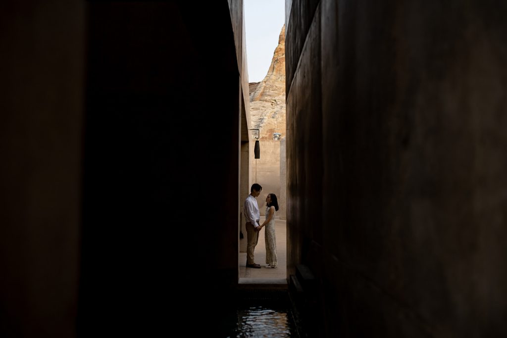 Bride and groom take a moment to themselves down an alley way.