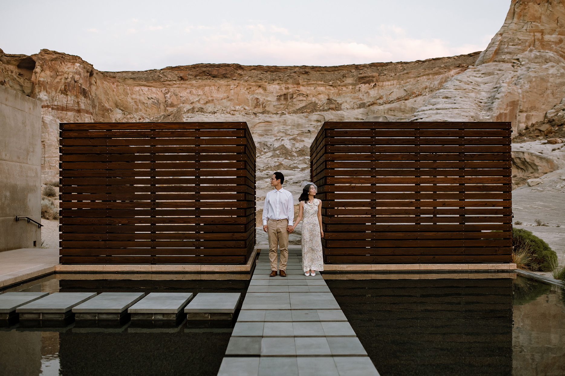 Couple looking in different directions, taking in the dessert beauty.