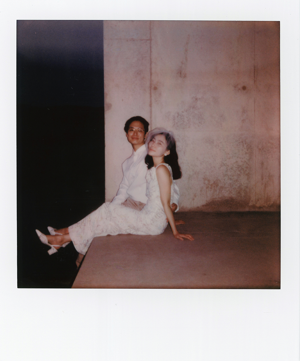 A nostalgic Poloroid of two lovers sitting on a concrete wall at Amangiri.