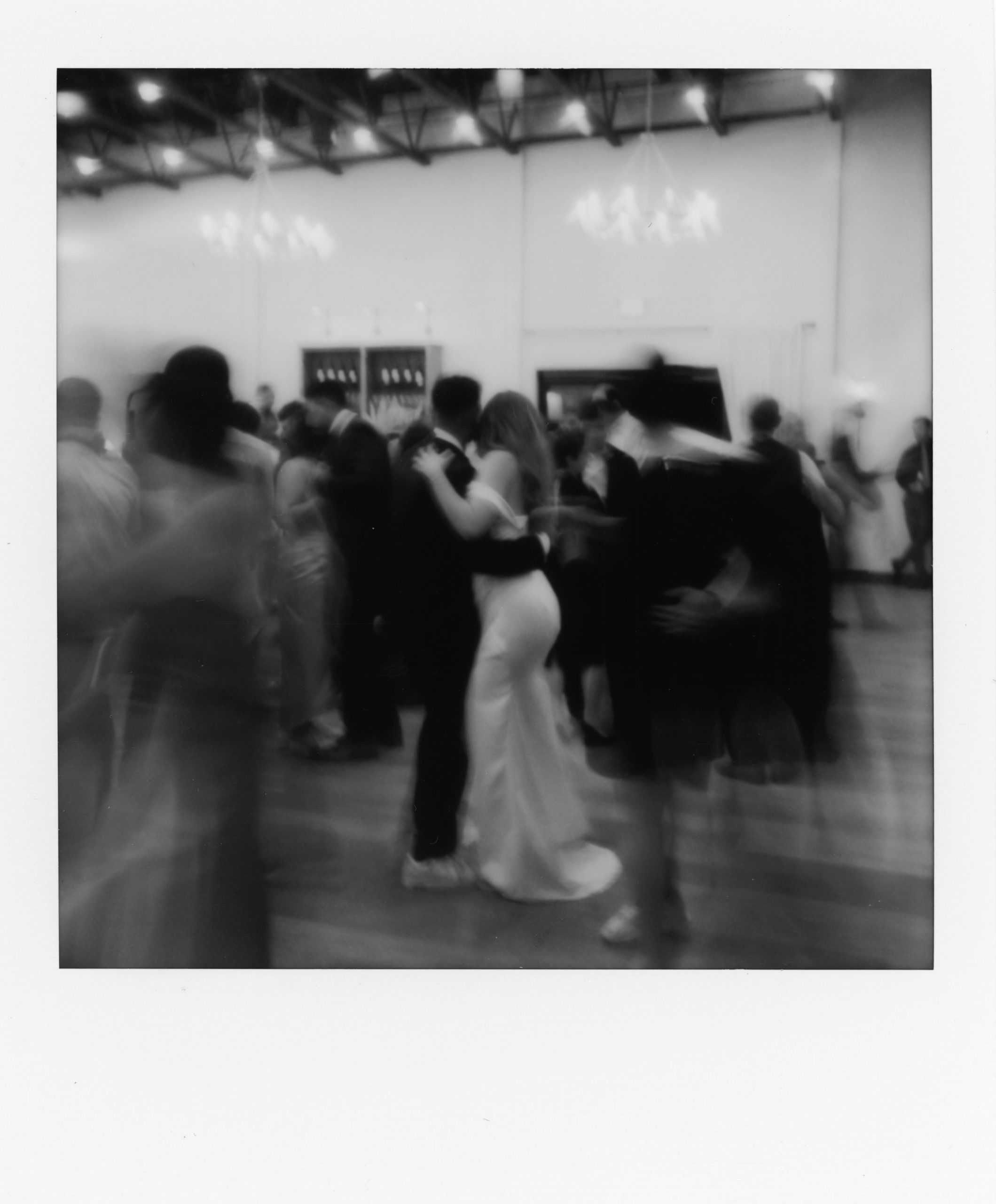 Polaroid of bride and groom's first dance