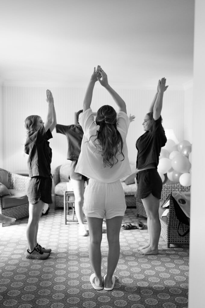 a wedding party does yoga at the grand america hotel