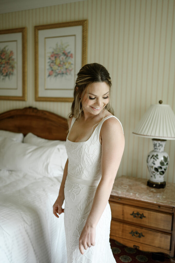 a bride gets dressed at grand america hotel