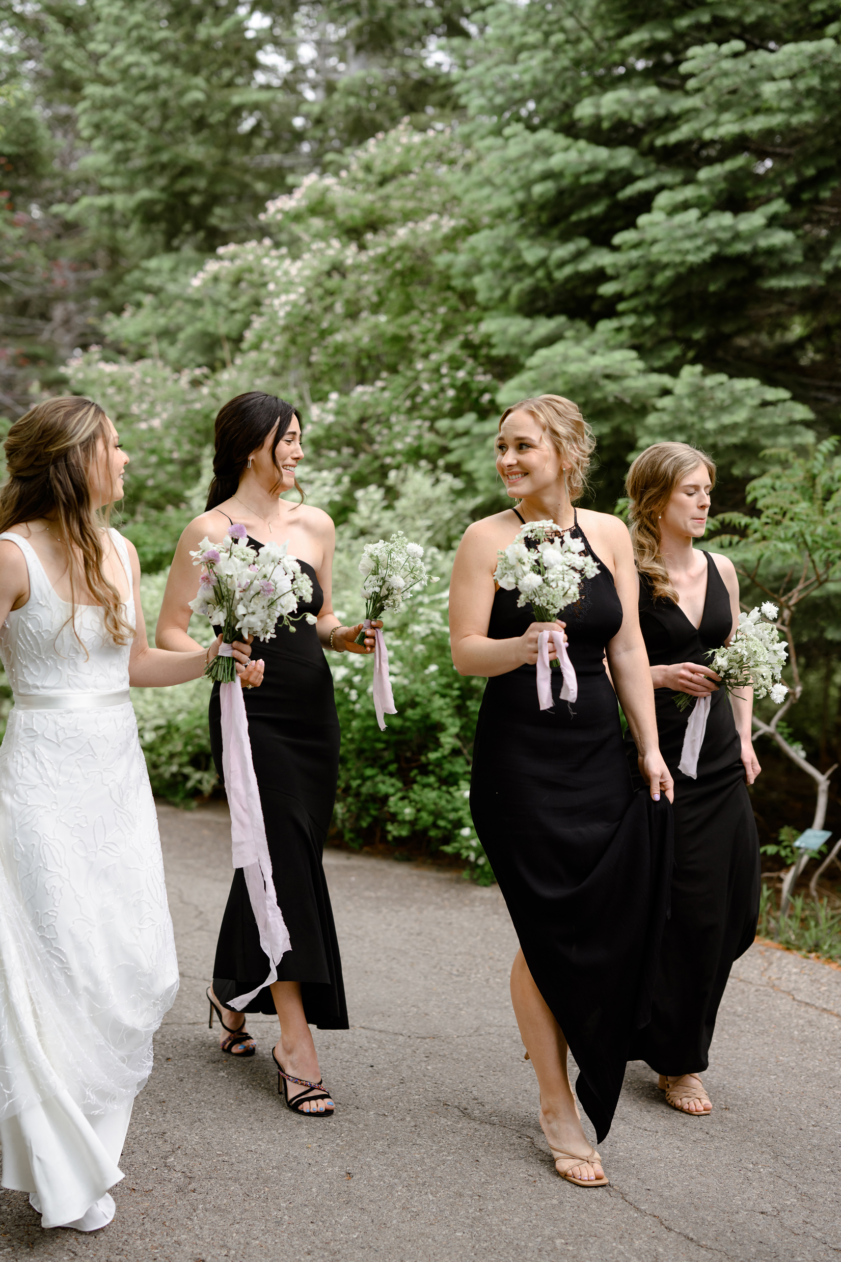 bridesmaids in black dresses at red butte gardens