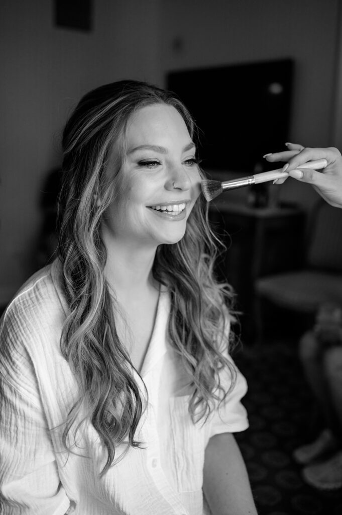 bride getting her makeup done at grand america hotel