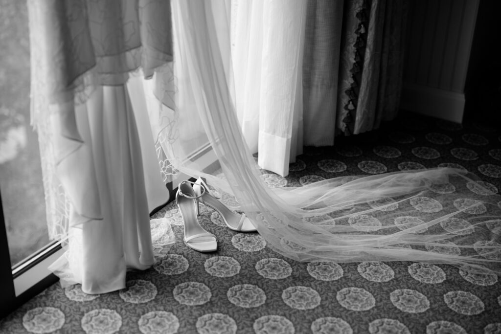 A sheer dress hanging in a window at the grand america hotel