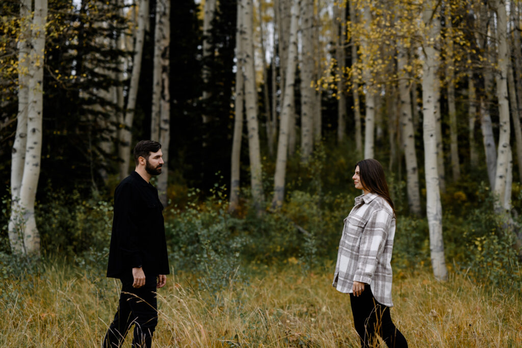 A couple together in the fall foliage of Park City