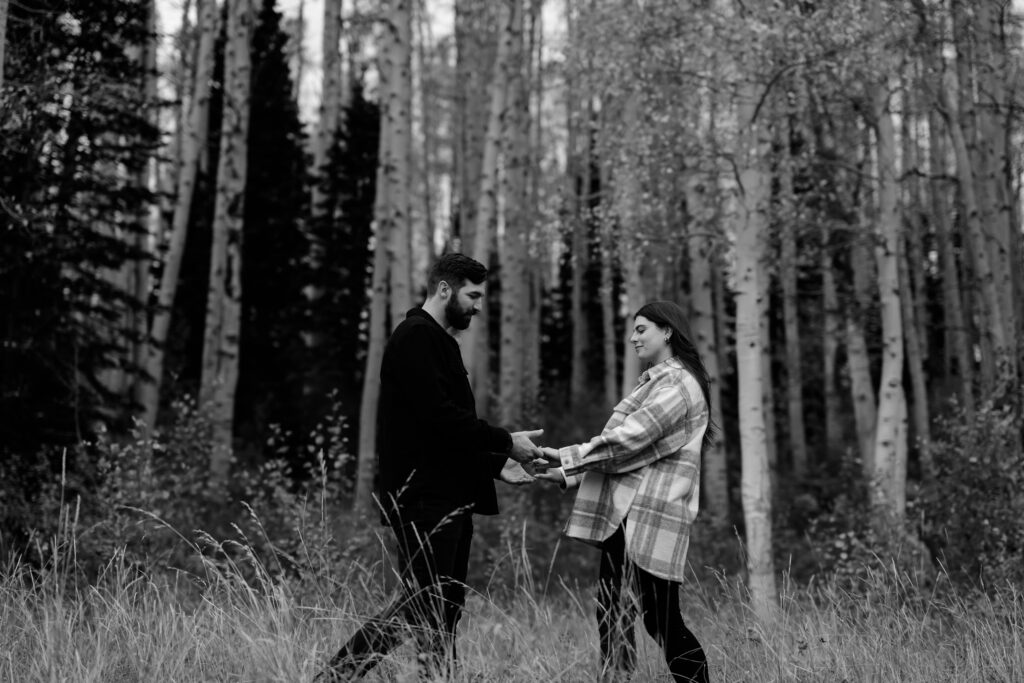 A couple together in the fall foliage of Park City