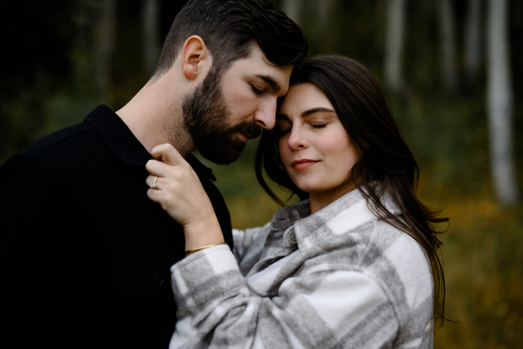 A couple together in the fall foliage of Park City