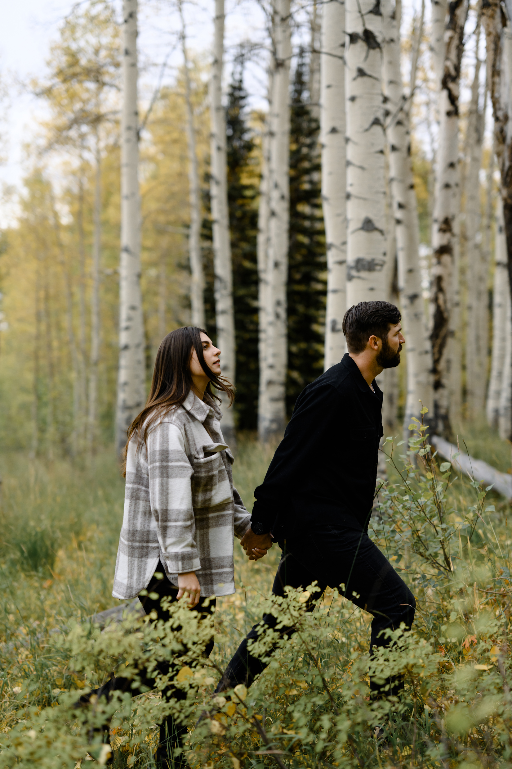 A couple together in the fall foliage of Park City