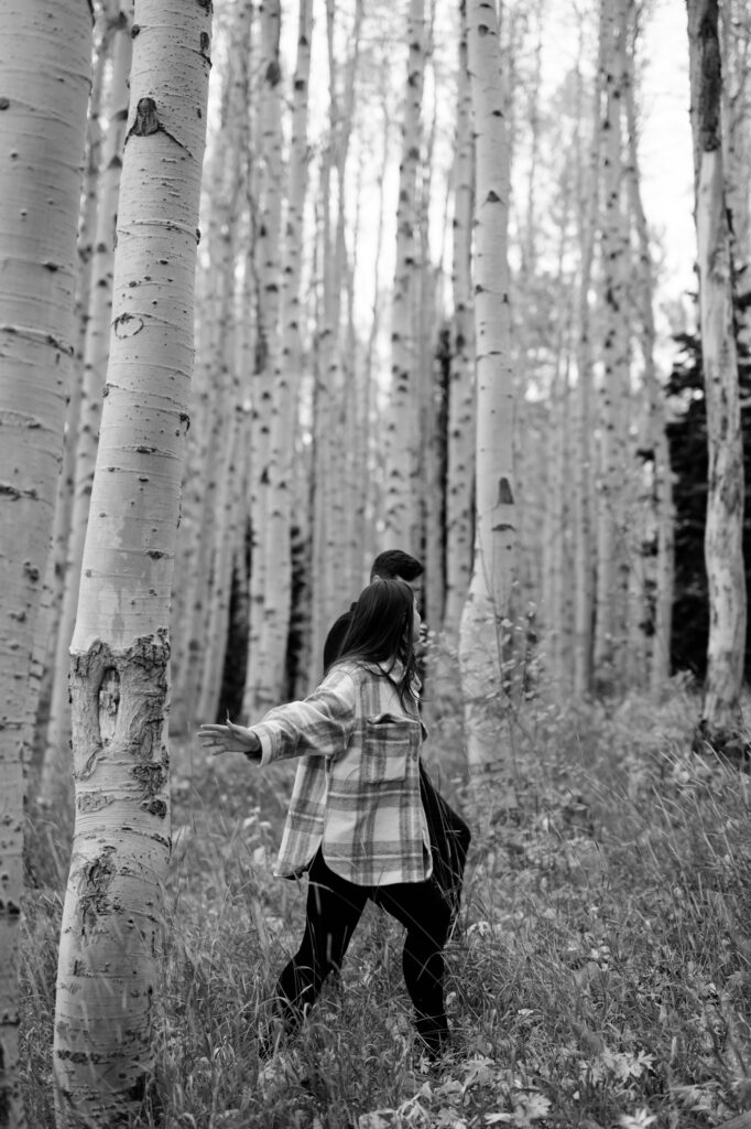 A couple together in the fall foliage of Park City