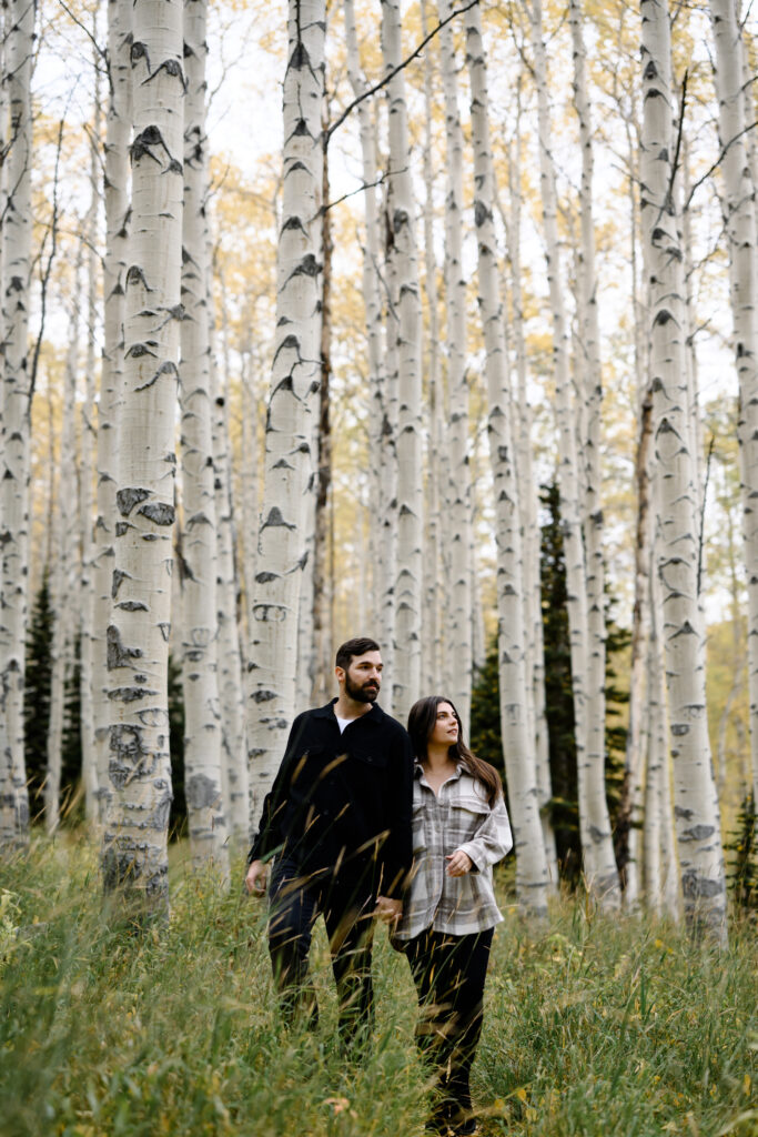 A couple together in the fall foliage of Park City