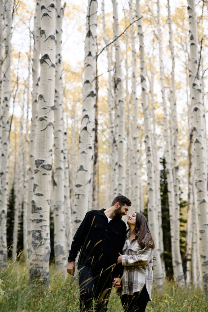 A couple together in the fall foliage of Park City