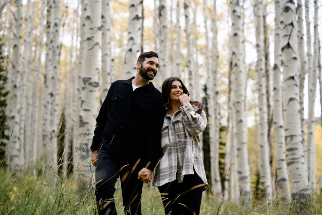 A couple together in the fall foliage of Park City