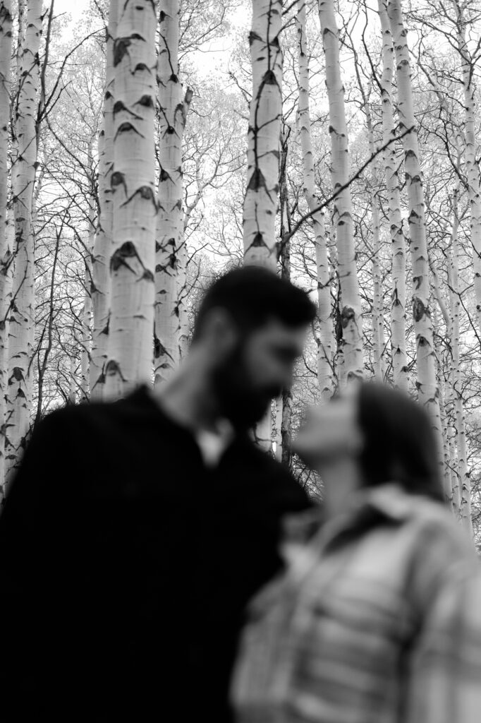 A couple together in the fall foliage of Park City