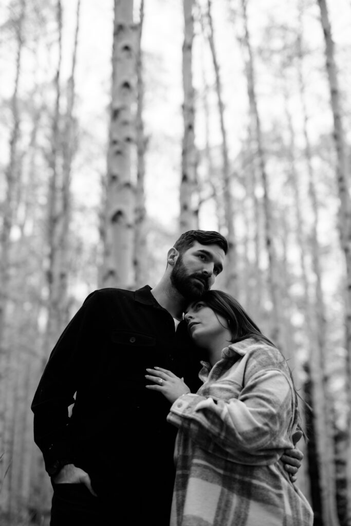 A couple together in the fall foliage of Park City