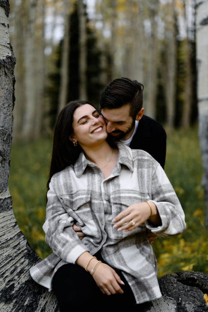 A couple together in the fall foliage of Park City