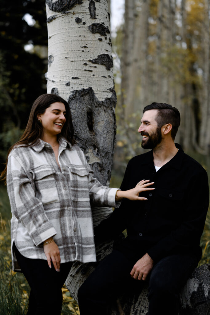 A couple together in the fall foliage of Park City