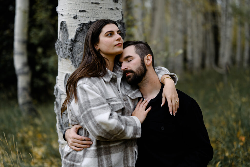 A couple together in the fall foliage of Park City