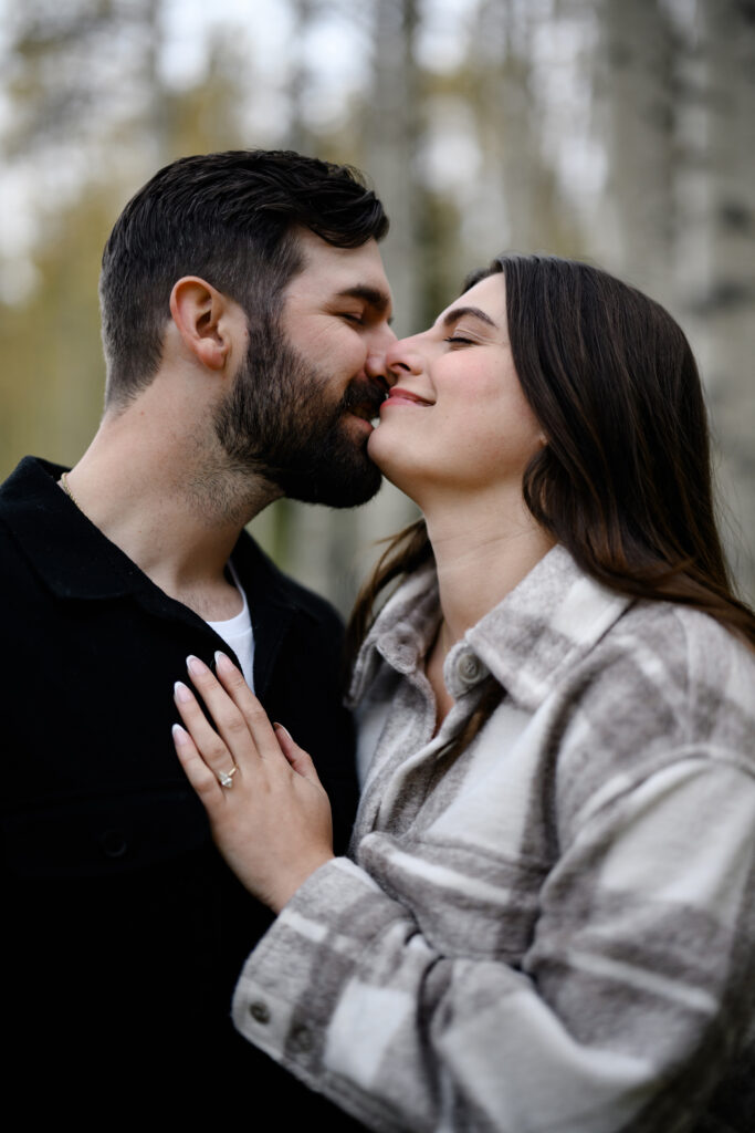 A couple together in the fall foliage of Park City