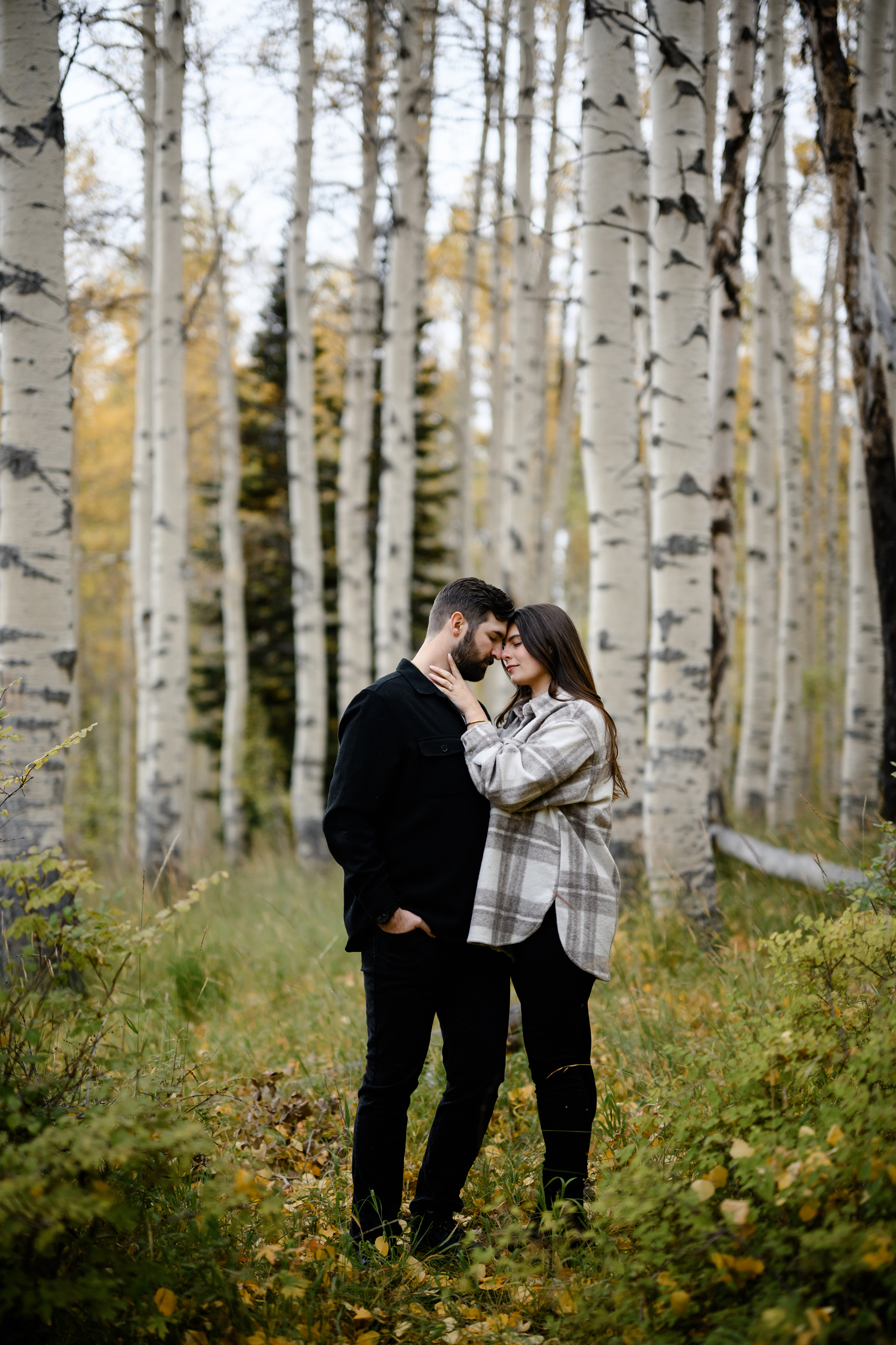 A couple together in the fall foliage of Park City